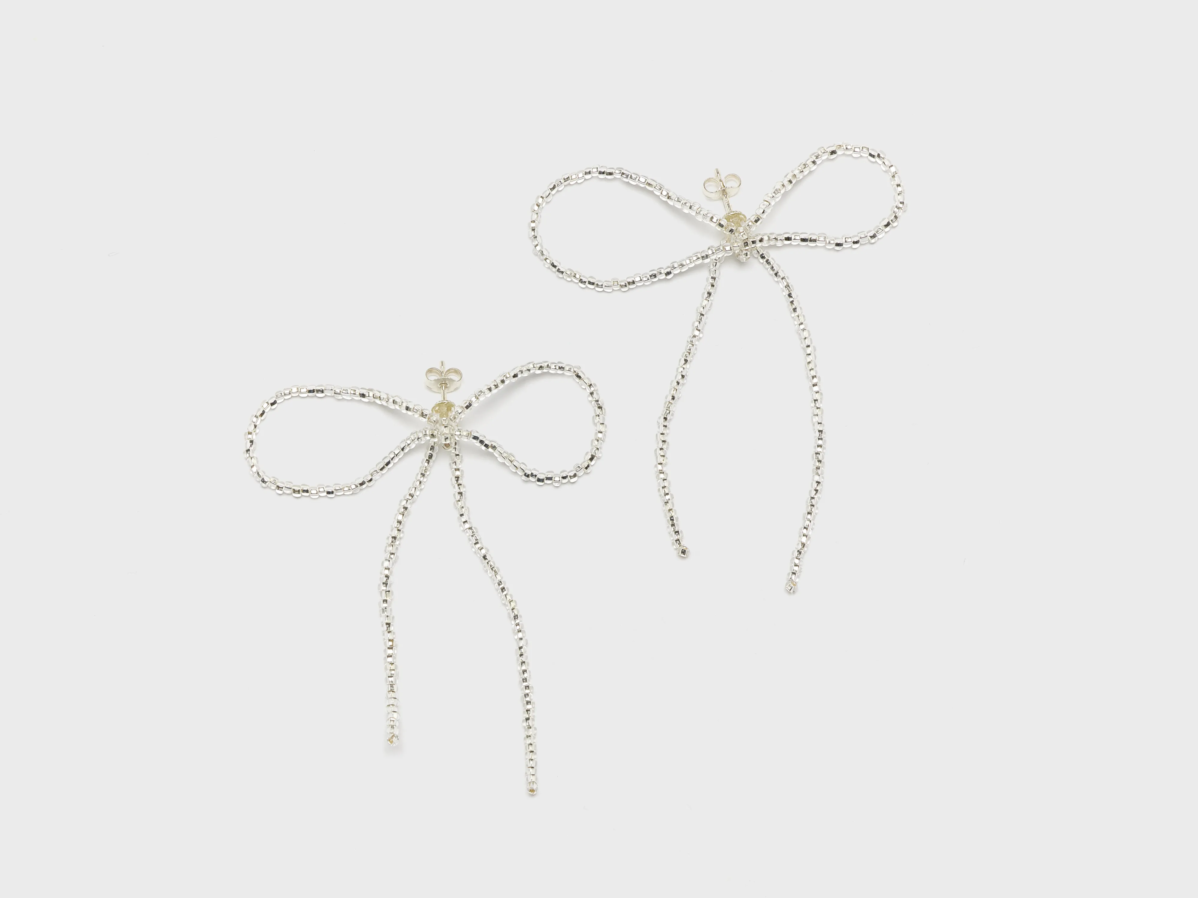 Sad Bow Ear Stick Earrings  (252 / W / SILVER)